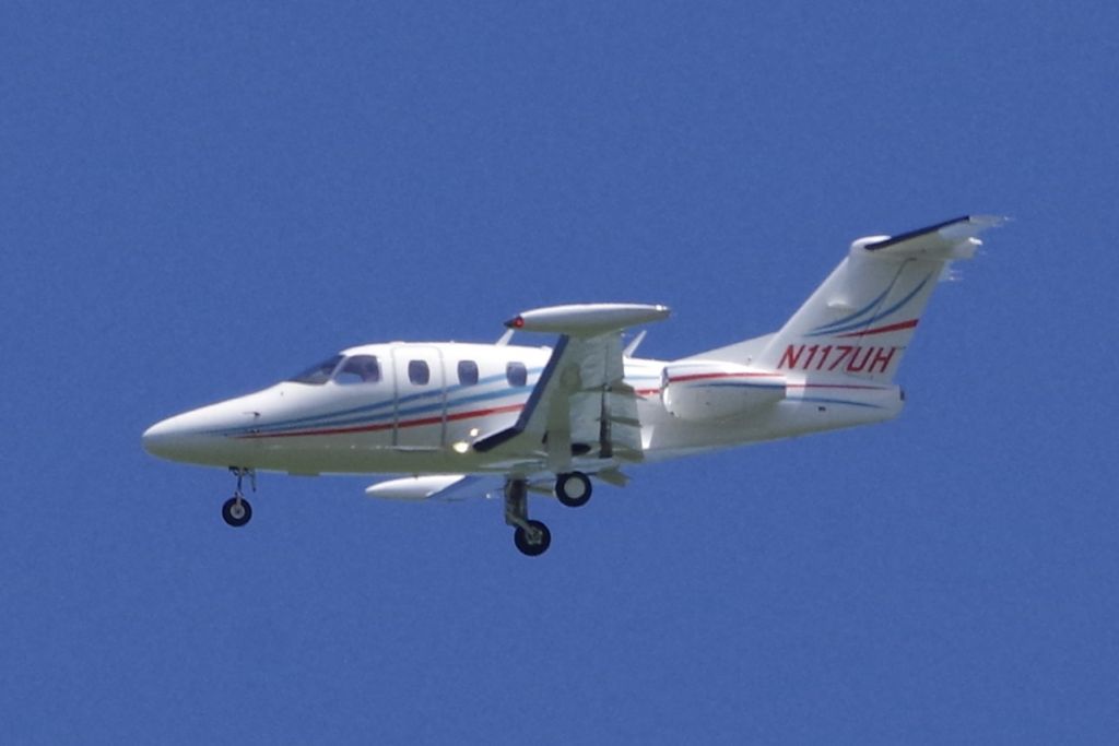 Eclipse 500 (N117UH) - Flying past my backyard in Fitchburg, MA.