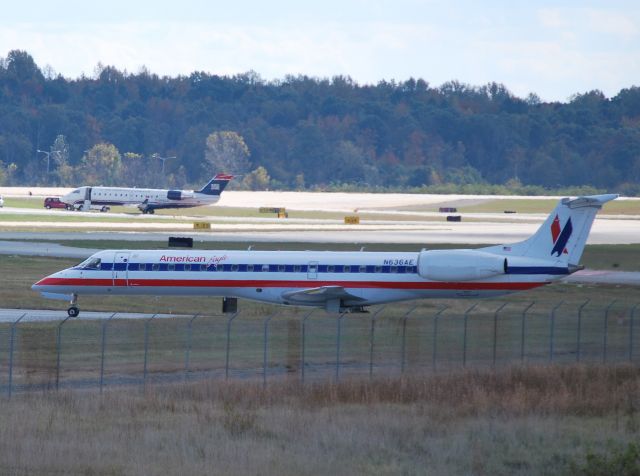 Embraer ERJ-145 (N636AE) - Taxiing in from 36L waiting to cross 36C - 11/6/10