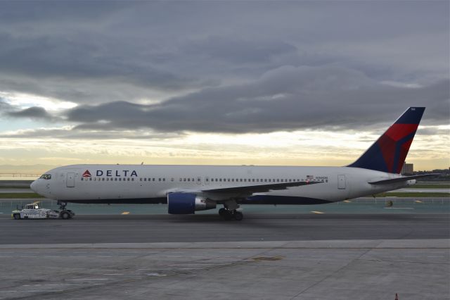 N188DN — - Delta Boeing 767 being towed. Shot from gate area at San Francisco International.