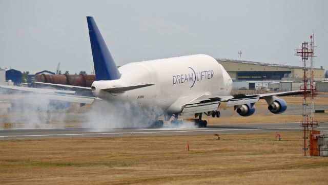 Boeing Dreamlifter (N718BA) - GTI4151 from RJGG / NGO makes tire smoke on landing Rwy 16R on 7/7/15. (ln 932 / cn 27042).