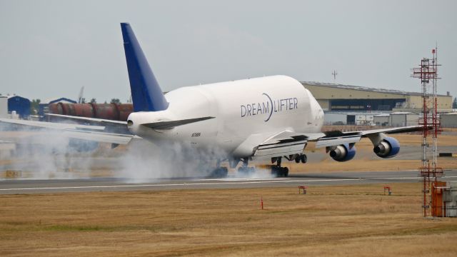 Boeing Dreamlifter (N718BA) - GTI4151 from RJGG / NGO makes tire smoke on landing Rwy 16R on 7/7/15. (ln 932 / cn 27042).