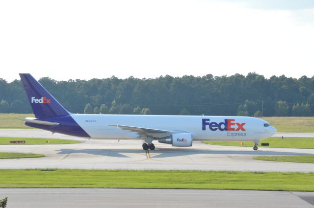 BOEING 767-300 (N123FE) - FedEx 795 is arriving from Memphis at 6:40 PM EDT.  Photo taken June 30, 2016 with a Nikon D3200 mounting 55-200mm VR2 lens set at F16 aperture.