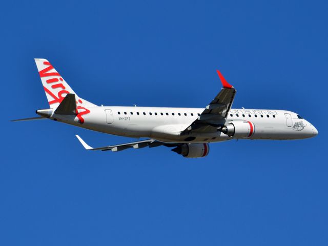 Embraer ERJ-190 (VH-ZPT) - Getting airborne off runway 23 on a beautiful Adelaide autumn day. Thursday 12th April 2012.