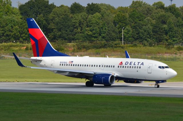 Boeing 737-700 (N301DQ) - Lined-up and waiting for takeoff clearance at KCLT - 9/22/18