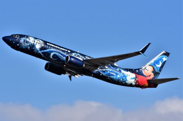 Boeing 737-800 (C-GWSZ) - WestJet (Disney's Micky Mouse Livery) Boeing 737-8CT departing YYC on Apr 20.