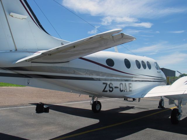 Beechcraft King Air 90 (ZS-OAE) - At the Orapa Diamond Mine, Botswana. Temperature 100F.