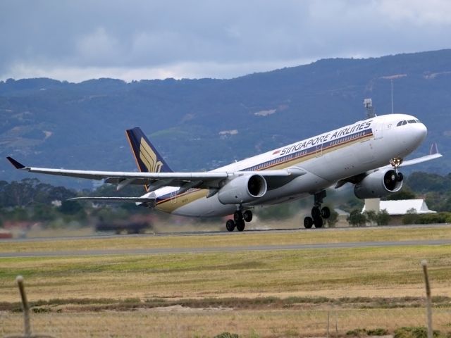 Airbus A330-300 (9V-STP) - Getting airborne off runway 23 and heading home to Singapore. Tuesday 27th December 2011.