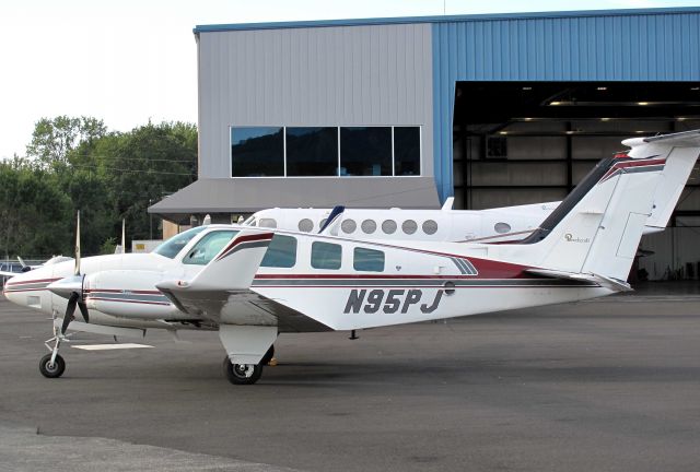 Beechcraft Baron (58) (N95PJ) - At Reliant Air, where you find the cheapest fuel at Danbury!