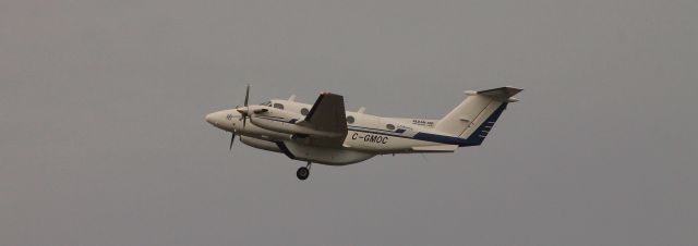Beechcraft Super King Air 200 (C-GMOC) - Canadian registered Beech 200 climng out. That pod has to hurt performance quite a bit.