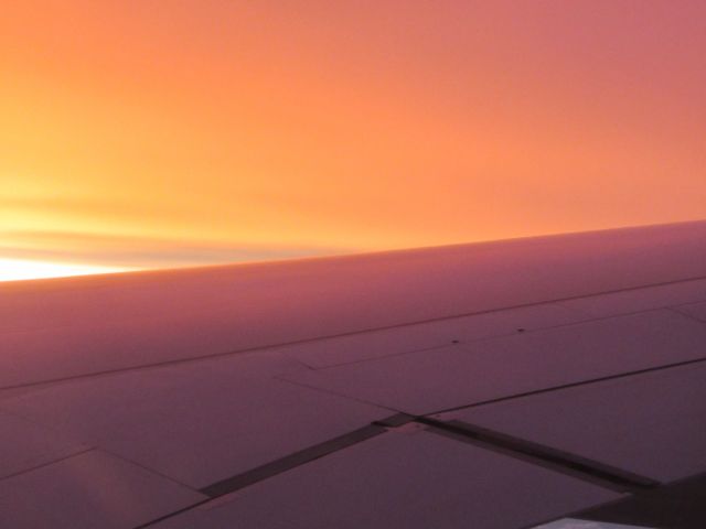 Airbus A330-200 (DQ-FJV) - Sunrise from seat 28K halfway through the 10.5 hour flight from Nadi to Los Angeles. July, 2014.