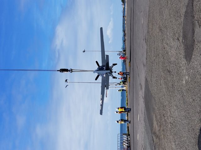 N5833 — - A F4F (FM-2 Wildcat) gets a free flight onto a barge before being loaded onto the USS Essex for a ride from O'ahu to the Mainland.