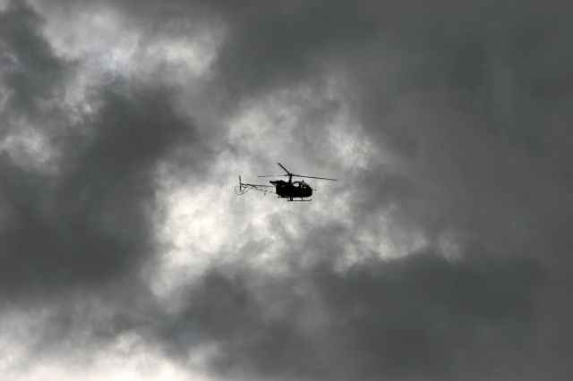 — — - Alouette II of Belgian Army overflying Bierset airport near Liege in the eastern part of Belgium.