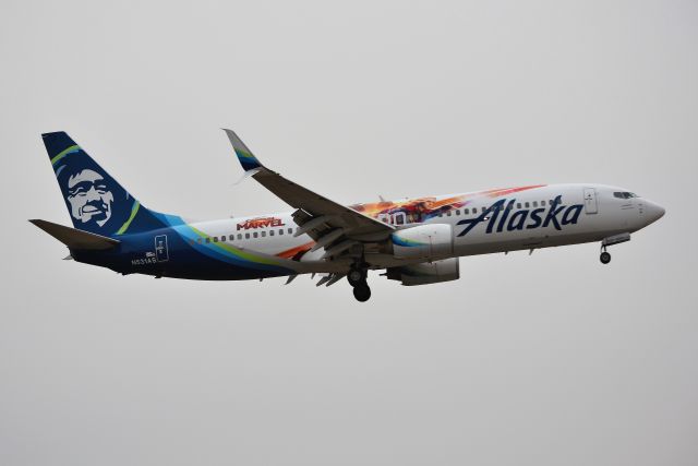 Boeing 737-800 (N531AS) - Coming back for its second visit in 9 days. Still dark overcast. At least it wasn't raining out like back on 02-10-19 (see my previous shots) A slightly better angle this time, showing more of the Captain Marvel decal. Shown landing 5-L at KIND from KSEA earlier this evening at around 1715.