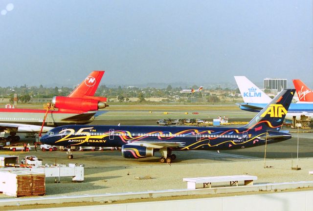 Boeing 757-200 (N520AT) - KLAX - ATA Anniversary jet arriving at LAX - one of the few times we've pulled up to the view point and a neat jet landed. This view long gone from the top floor of the parking structure - view now blocked by buildings - to the left of view 180 degrees is the TBT.