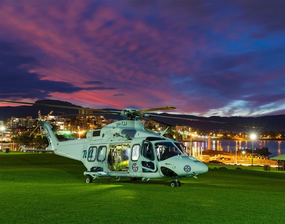 BELL-AGUSTA AB-139 (VH-TJJ) - Landing at dusk outside Sydney waiting for patients from a nearby watercraft incident. Ambulance Service of New South Wales, using Toll Aviation as the aeromedical service provider.