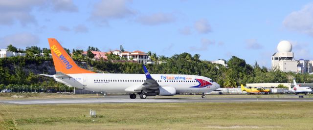 Boeing 737-800 (C-GVVH) - SXM over New Year's. Sunwing adds more colour to the Princess.