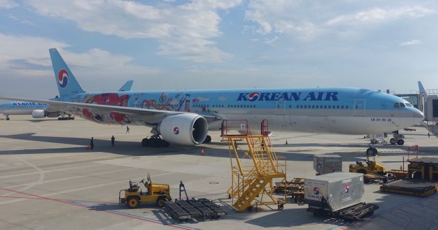 BOEING 777-300ER — - Parked at gate next to this special livery 777-300ER.