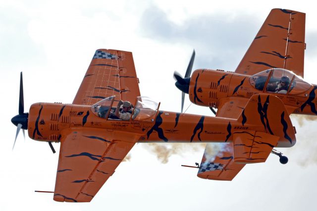 — — - Twin Tiger Aerobatic Team Buck Roetman and Mark Sorenson in two identical Tiger Yak 55’s at the Stuart, FL Airshow 2013