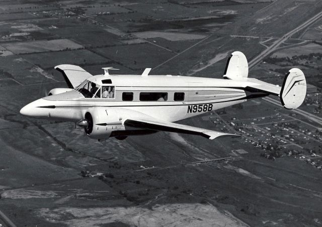 N958B — - Aircraft had a wheels up in 1975. Photo taken from a beautiful Beechcraft brochure.