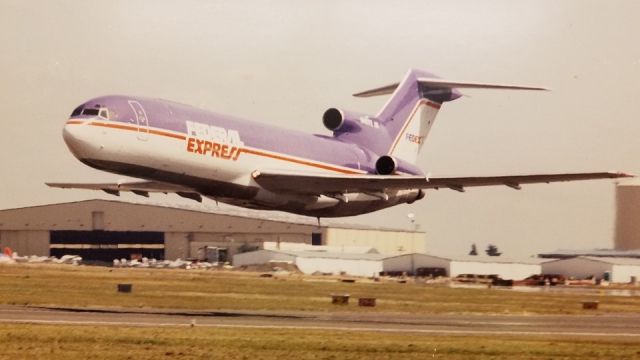 N243FE — - Flyby after conversion from Ansett Airlines tail number VH-RML serial number 21480 into freighter on delivery day Jan. 10, 1990. Work performed at the hangar in background is Tramco / BF Goodrich Aerospace, Paine Field, Everett, Washington. South end of field.