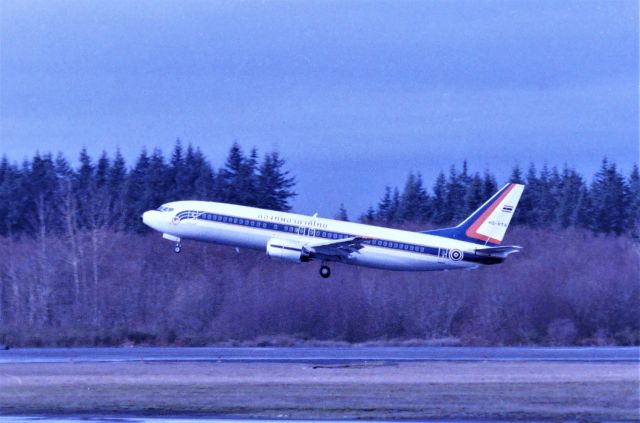 BOEING 737-400 (HS-RTA) - KPAE - Feb 1995 at Boeing Everett this brand new Thai Air Intl 737-400 did one touch and go while I was at the mid parking lot near the Tower - so lucky to get this shot. Online records show this jet first flew 2/13/1995 which would have been right about this date...Then, late Feb 1995 this shows going to Royal Thai Air Force as ship 55-555 a few weeks later. In November 2005 the reg was changed to HS-CMV. LN: 2698. When I took this photo I had no Idea who/what this jet was for.