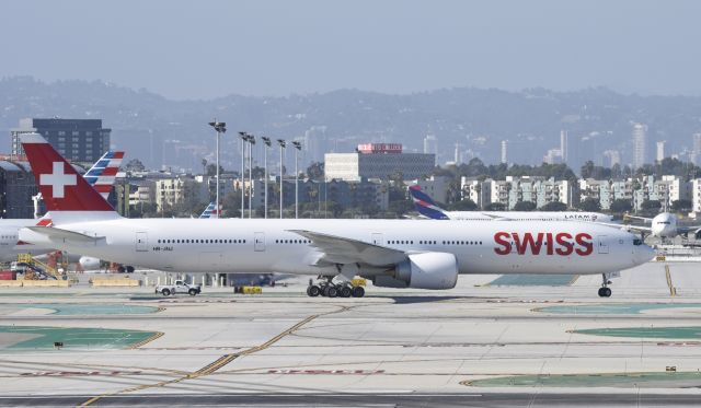 BOEING 777-300ER (HB-JNJ) - Taxiing to gate at LAX