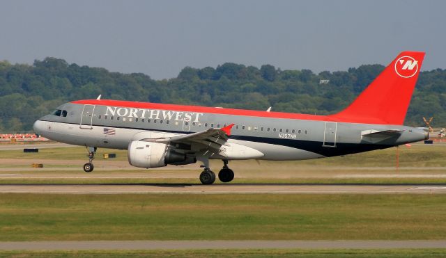 N357NB — - A Northwest A319-114 tip toeing into Nashville in 2008. N357NB now flies in Delta colors. The X in the background marks runway 31 closed for major construction.