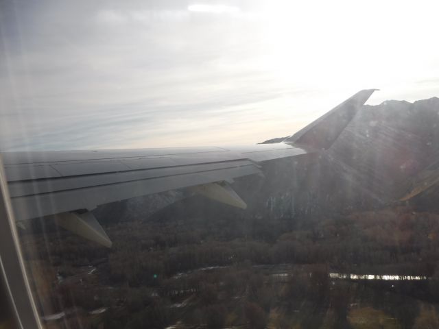 Embraer 175 (N286SY) - taking off from the Hailey airport in Hailey Idaho looking west