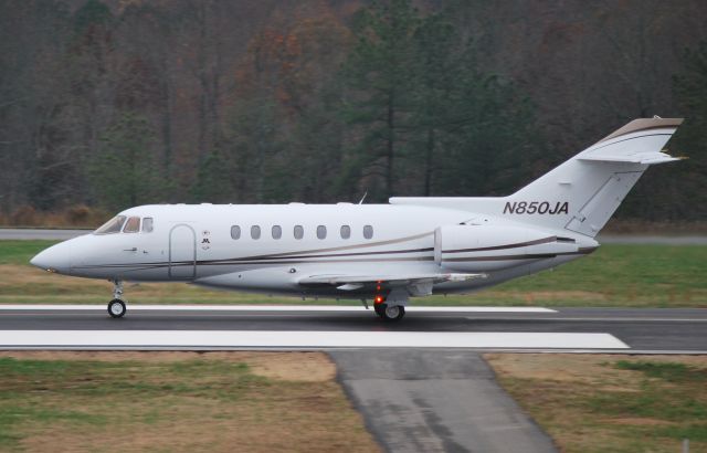 Hawker 1000 (N850JA) - Rolling down runway 20 at Concord Regional Airport (KJQF) - 11/19/09