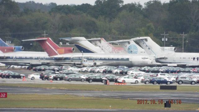 Boeing 727-100 — - Various B727 retired at KMQY Smyrna, TN along with Nissan mfg use of tarmac for vehicle storage.