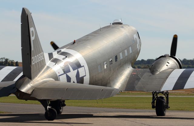 — — - A Douglas C-47 Dakota turns to face into wind, about to perform an engine run up.