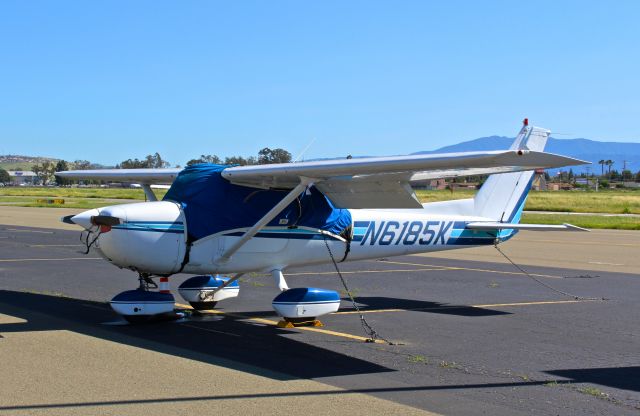 Cessna Commuter (N6185K) - Locally-based Cessna 150 parked on the transient ramp after being towed at Reid Hillview.
