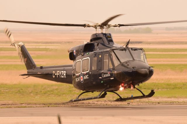 Bell 412 (C-FYZR) - RCAF Bell 412 just lifting off from YQV