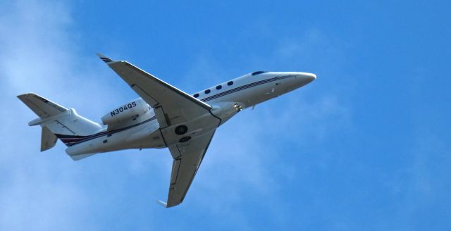 Embraer Phenom 300 (N304QS) - Shortly after departure is this 2013 Embraer Phenom 300 from the Summer of 2024.
