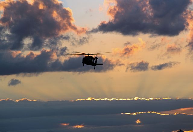 — — - BlackHawk arriving at SIG at Dusk.