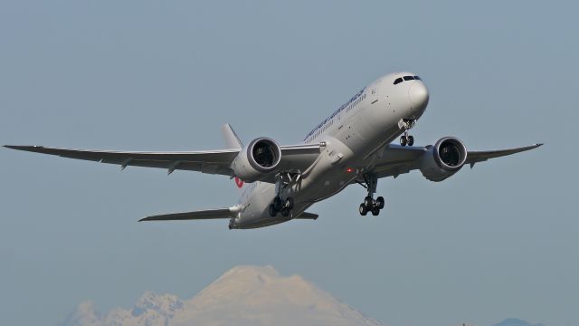 Boeing 787-8 (JA837J) - BOE195 climbs from Rwy 16R for a flight test on 11/17/14. (ln 222 / cn 34860). Mt Baker is visible in the distance.