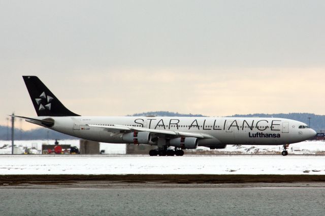 Airbus A340-300 (D-AIGP) - Lufthansa A340-300 in Star Alliance livery arriving to a snowy Logan Airport on 2/20/21. This aircraft also diverted to Logan from JFK due to weather on 2/18/21. 