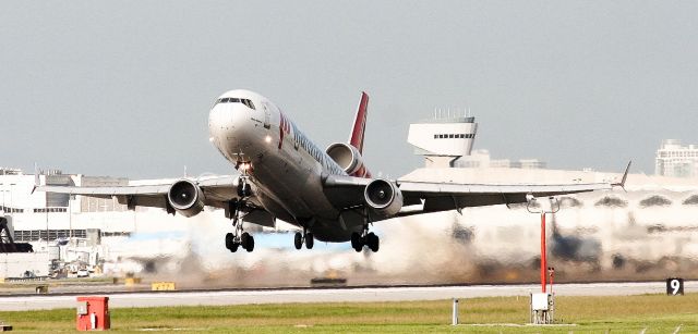 Boeing MD-11 (PH-MCW) - Check out our aviation videos with 100% authentic and non-leveled sound! a rel=nofollow href=http://youtube.com/ilikeriohttps://youtube.com/ilikerio/abr /br /Martinair Cargo MD-11 rocketing off of runway 27 after some rain. This bird landed, refueled, reloaded, and took off again in less than 30 minutes! :D Taken from El Dorado Furniture. 8/12/12