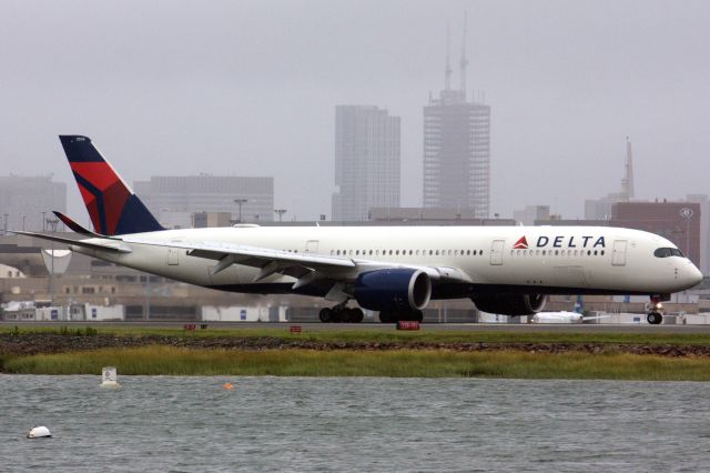 Airbus A350-900 (N506DN) - Delta A350-900 arriving to Boston Logan under cloudy/foggy conditions from Tropical Storm Henri on 8/22/21.  