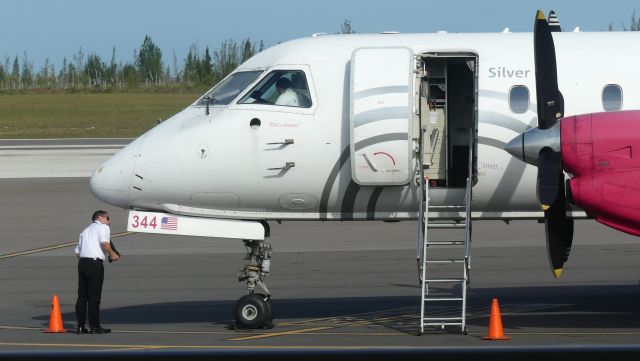 N344AG — - Nose wheel inspection during walkaround.