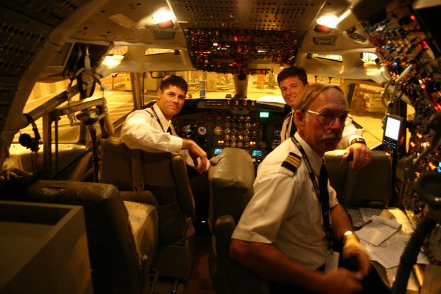 Boeing 707-100 (N707JT) - John Travolta's aircrew getting the Boeing 707 ready for an evening departure from Sydney to Cairns - 20th November 2005