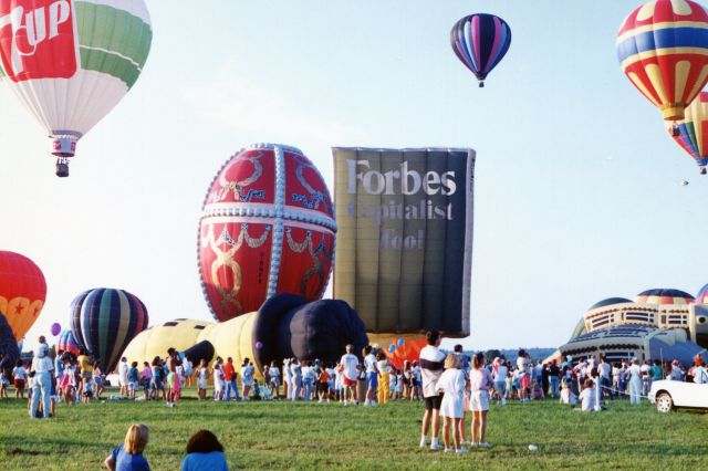 Unknown/Generic Balloon (G-BNFK) - ALEXANDRIA AIRPORT-PITTSTOWN, NEW JERSEY, USA-Circa early 1990s: Seen at the Magic of Alexandria Balloon Festival were two of the many hot air balloons belonging to the late Malcolm Forbes, publisher of FORBES magazine. Seen are the Faberge Egg balloon, registration number G-BNFK and the magazine shaped Forbes Capitalist Tool balloon. The balloons of Malcolm Forbes were often seen at the balloon festivals in his home state of New Jersey.