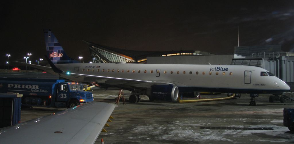 Embraer ERJ-190 (N190JB) - A jetBlue E190, "Luiz F. Kahl" (N190JB), is serviced by the Prior Aviation folks in this photo taken early on a brisk December morning at Buffalo Niagara International (KBUF).  