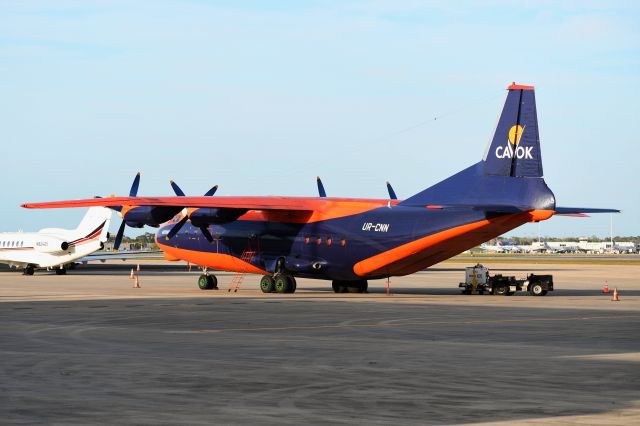 Antonov An-12 (UR-CNN) - Super rare visitor basking in the last light of the day.