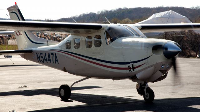 Cessna P210 Pressurized Centurion (N5447A) - A great P210 "R" model, 325HP. Factory intercooler. Parked at RELIANT AIR, where you find the lowest fuel prices on the Danbury (KDXR) airport.