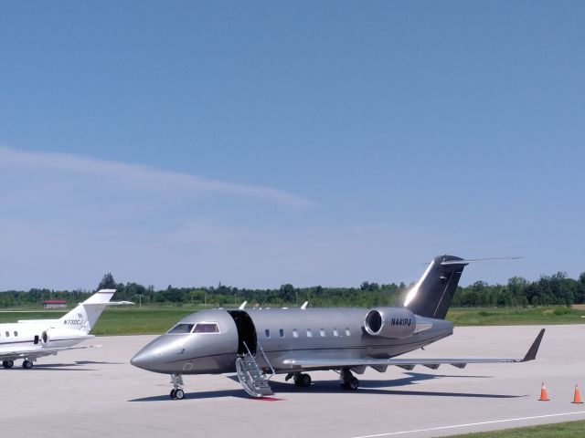 Canadair Challenger (N441PJ) - Patio at airport.  I think they brought up the band for nearby concert. 