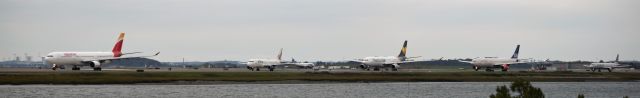 — — -  Iberia, jetBlue, Thomas Cook, SAS, and American making  up part of the evening line up on taxiway November. 