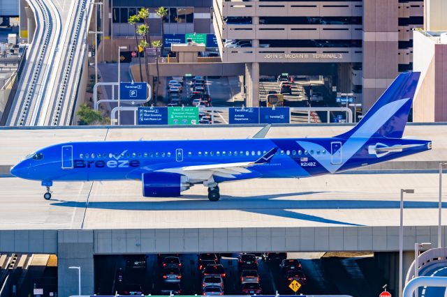 Airbus A220-300 (N214BZ) - A Breeze Airways A220-300 taxiing at PHX on 2/9/23 during the Super Bowl rush. Taken with a Canon R7 and Tamron 70-200 G2 lens.