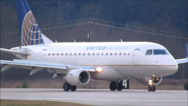 Embraer 170/175 (N861RW) - A United Express Embraer 170 landing at Raleigh-Durham Intl. Airport. This was taken from the observation deck on January 17, 2016 at 4:35 PM. This is flight 3526 from ORD.