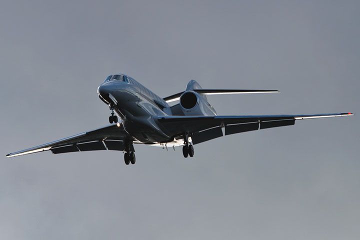 Cessna Citation X (N726XJ) - 3/31/13:  XOJet Citation X on short final approach in the late afternoon over Miami Lakes after a flight from Teterboro to Opa-locka Executive Airport.